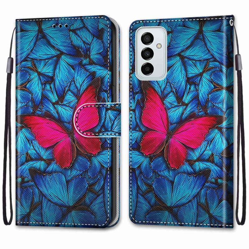 Flip Case Samsung Galaxy M23 5G Punainen Perhonen Sinisellä Taustalla