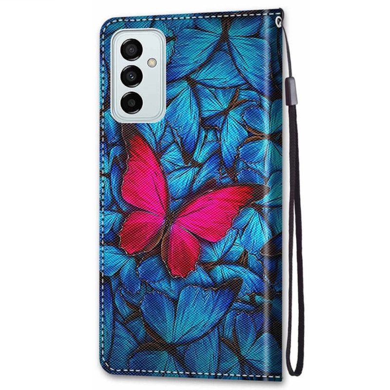 Flip Case Samsung Galaxy M23 5G Punainen Perhonen Sinisellä Taustalla