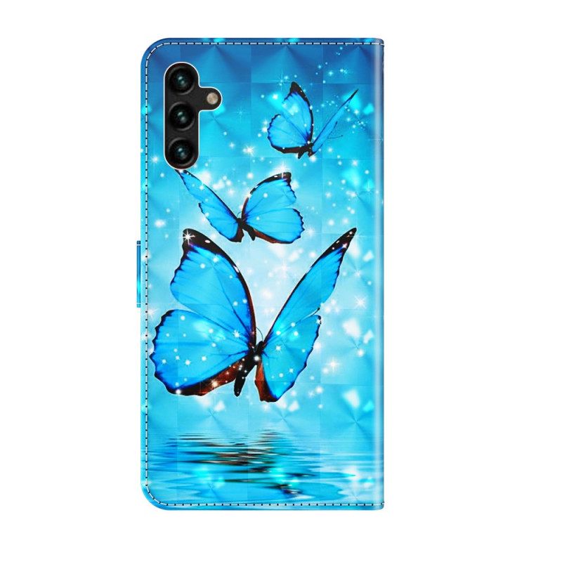 Nahkakotelo Samsung Galaxy A13 5G Flying Blue Butterflies