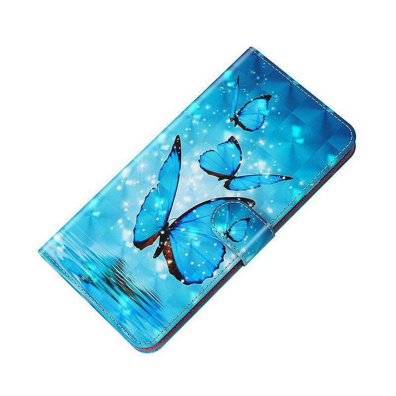 Kotelot Samsung Galaxy S21 FE Flying Blue Butterflies