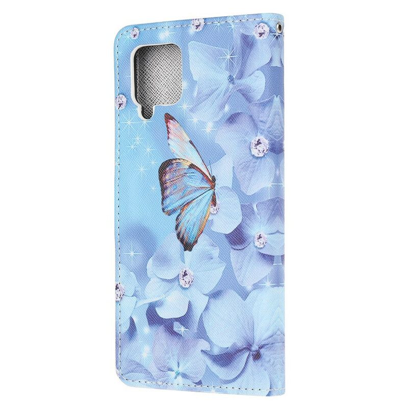 Nahkakotelo Samsung Galaxy A12 / M12 Suojaketju Kuori Diamond Butterflies Hihnalla